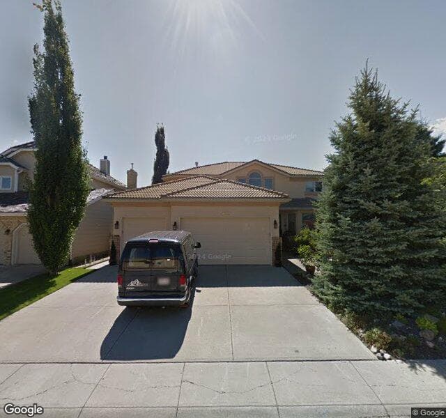 Street view of 112 Woodhaven Crescent SW, Calgary