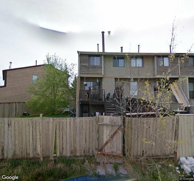 Street view of 135 Woodvale Bay SW, Calgary