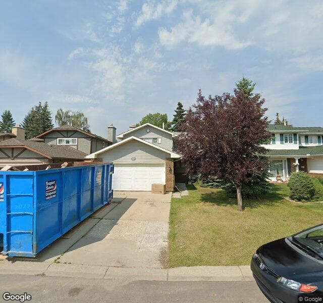 Street view of 111 Woodmont Drive SW, Calgary