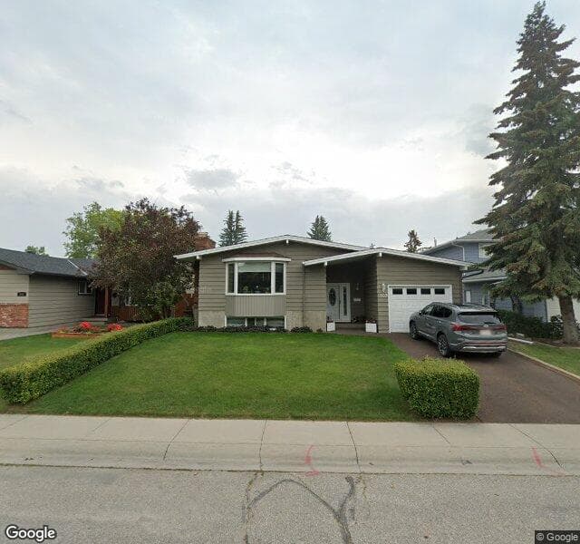 Street view of 107 Lake Lucerne Crescent SE, Calgary