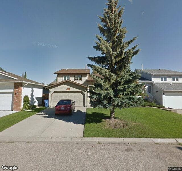 Street view of 111 Woodstock Place SW, Calgary