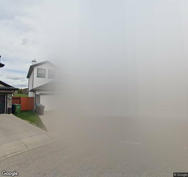 Street view of 132 Rocky Ridge Heath NW, Calgary