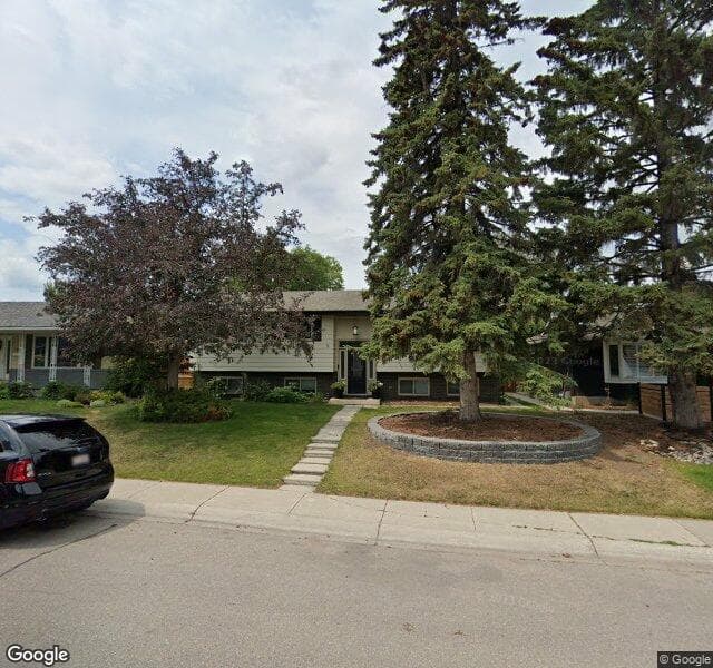 Street view of 1027 Lake Twintree Drive SE, Calgary