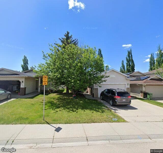 Street view of 10465 Hidden Valley Drive NW, Calgary