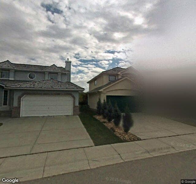 Street view of 142 Hamptons Grove NW, Calgary