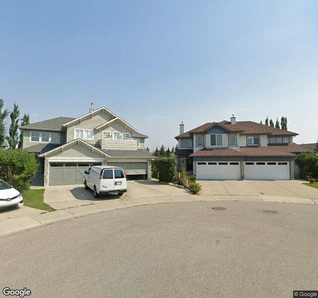 Street view of 129 Cougarstone Place SW, Calgary