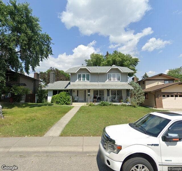 Street view of 116 Lake Wood Place SE, Calgary