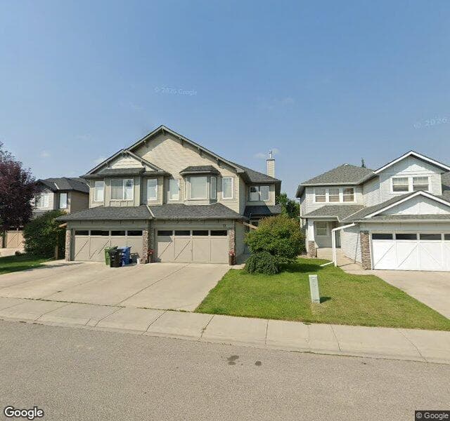 Street view of 13 Cougarstone Place SW, Calgary
