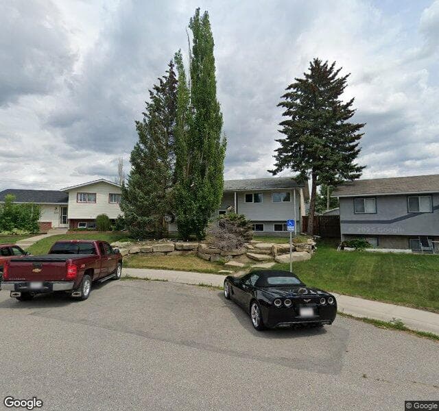 Street view of 1120 Lake Huron Crescent SE, Calgary