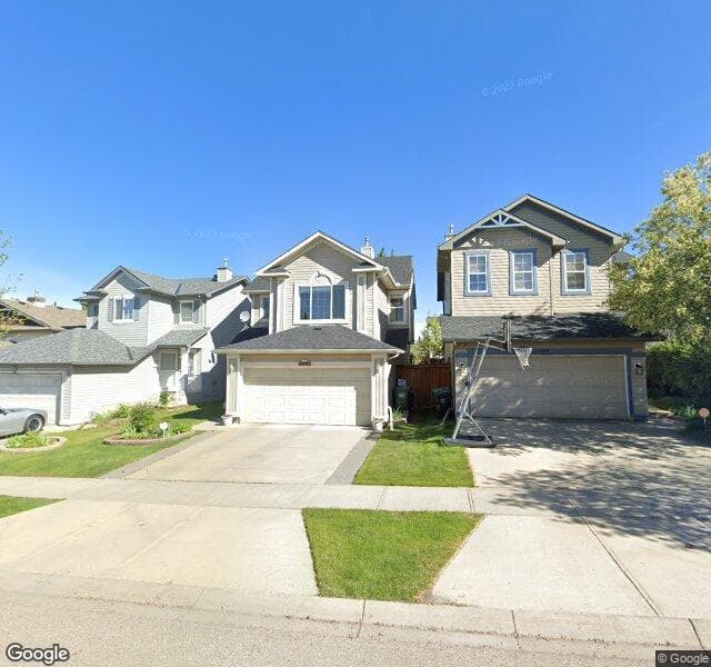 Street view of 1047 Tuscany Drive NW, Calgary