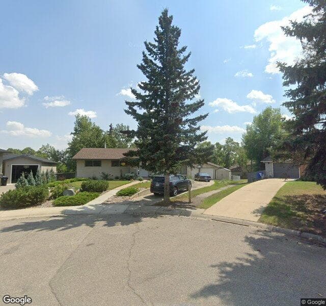 Street view of 223 Cantree Bay SW, Calgary