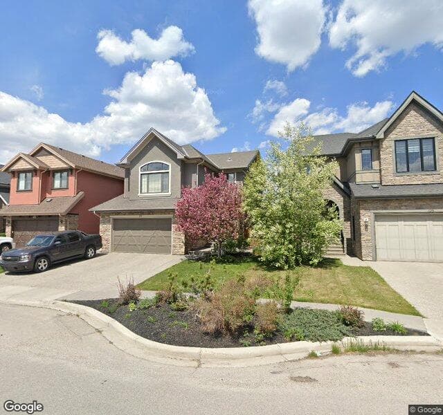 Street view of 129 W Coach Place SW, Calgary