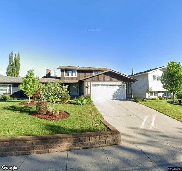 Street view of 1511 Lake Bonavista Drive SE, Calgary