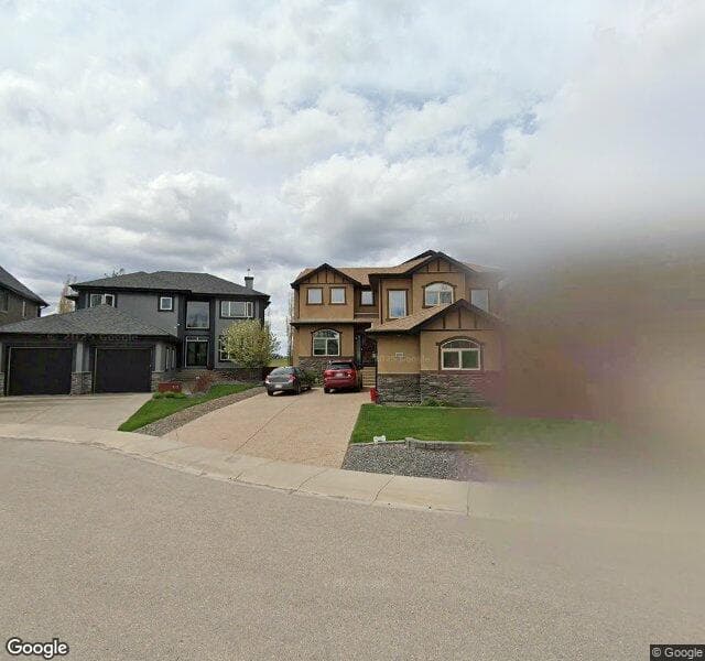 Street view of 109 Rockcliff Bay NW, Calgary