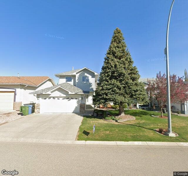 Street view of 112 Hidden Vale Crescent NW, Calgary