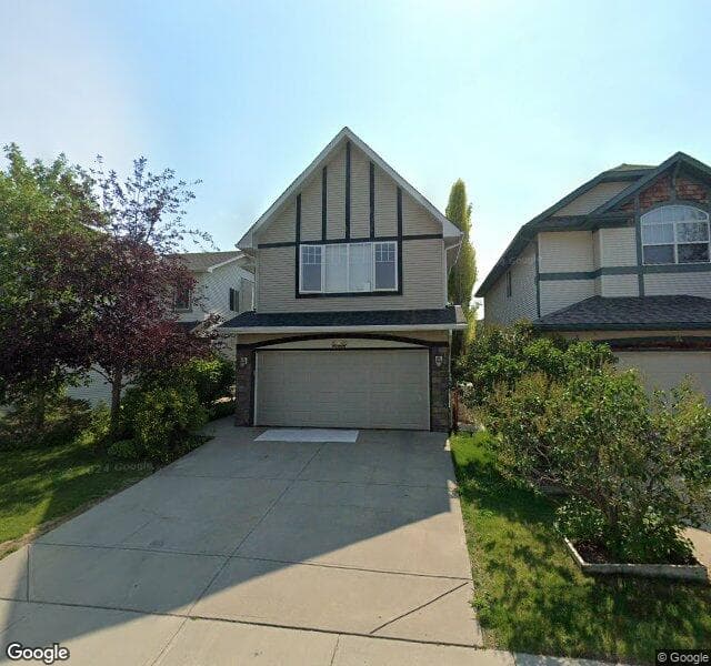 Street view of 10 Cougarstone Park SW, Calgary