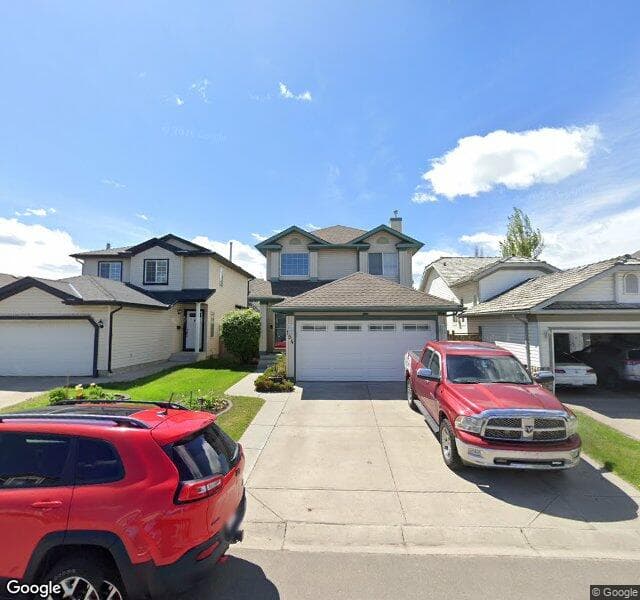 Street view of 154 Mount Apex Crescent SE, Calgary