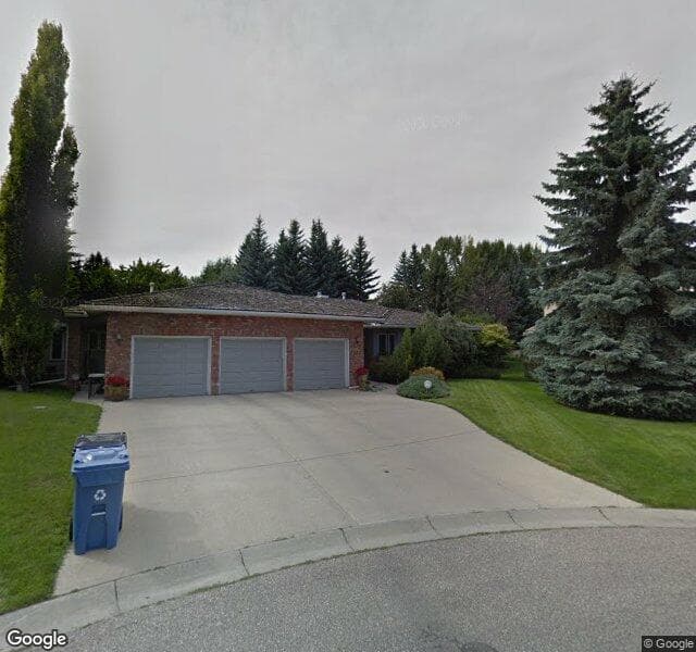 Street view of 122 Pumpridge Place SW, Calgary