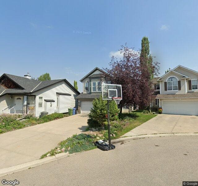 Street view of 111 Cougarstone Gardens SW, Calgary