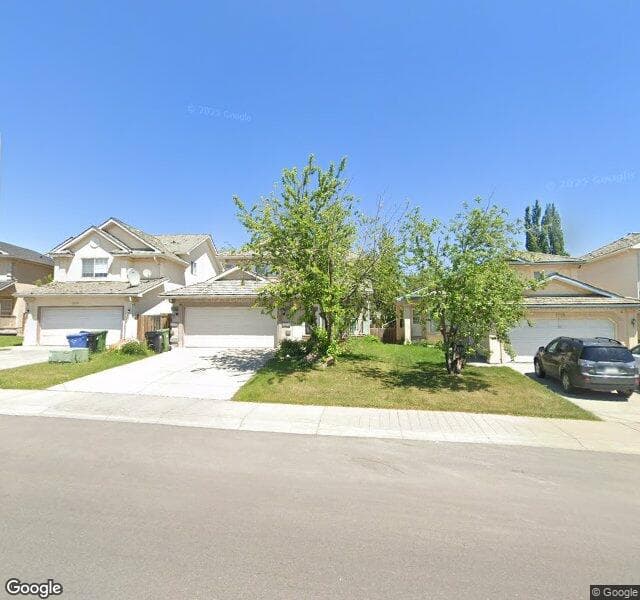 Street view of 1522 Harvest Hills Drive NE, Calgary