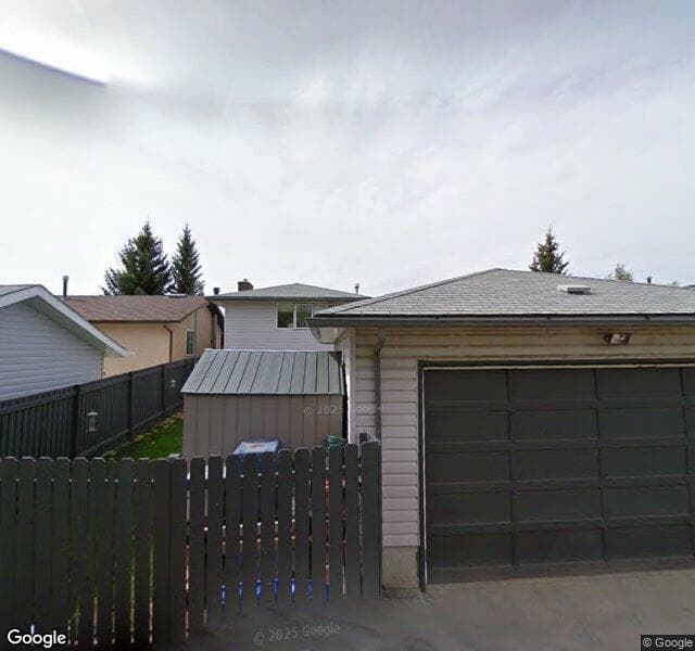 Street view of 371 Woodvale Crescent SW, Calgary