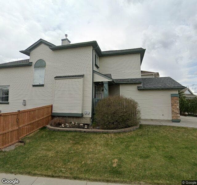 Street view of 303 Rocky Ridge Mews NW, Calgary