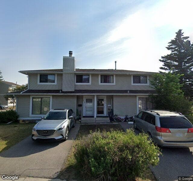 Street view of 102 Pinestream Place NE, Calgary