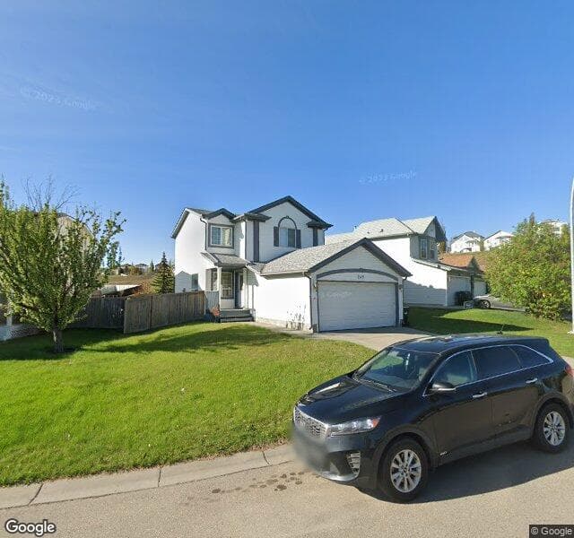 Street view of 246 Hidden Spring Mews NW, Calgary