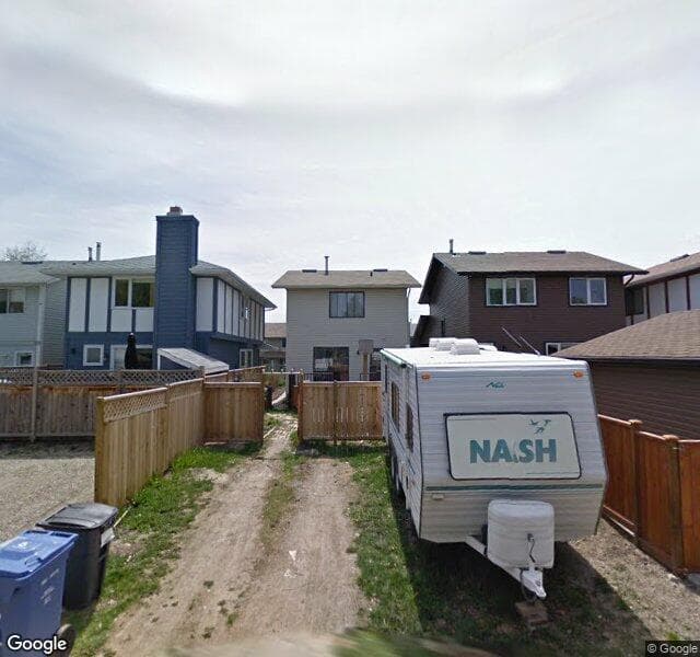 Street view of 130 Woodfield Close SW, Calgary