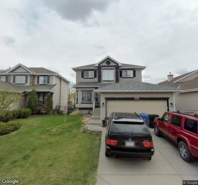 Street view of 133 Rocky Ridge Cove NW, Calgary