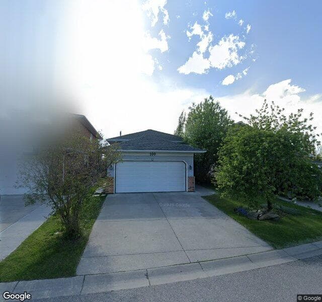 Street view of 100 Riverwood Close SE, Calgary
