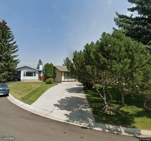 Street view of 104 Woodside Bay SW, Calgary