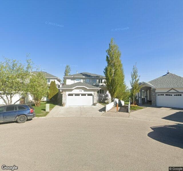 Street view of 112 Hidden Vale Place NW, Calgary