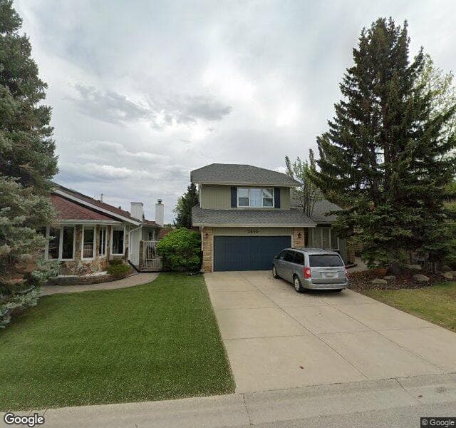 Street view of 2435 Deer Side Drive SE, Calgary