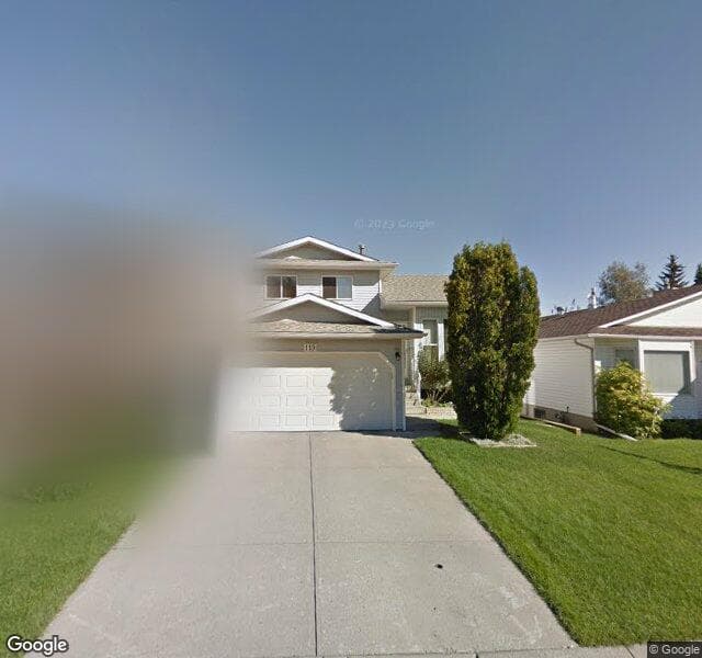 Street view of 119 Woodstock Place SW, Calgary