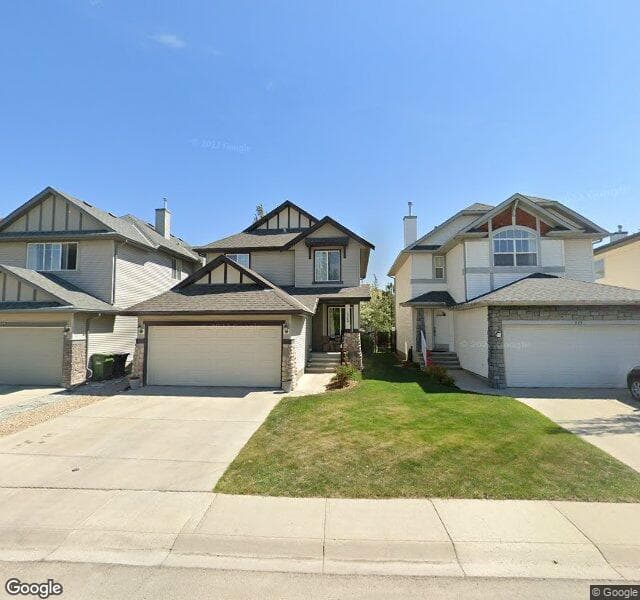 Street view of 219 Cougarstone Court SW, Calgary