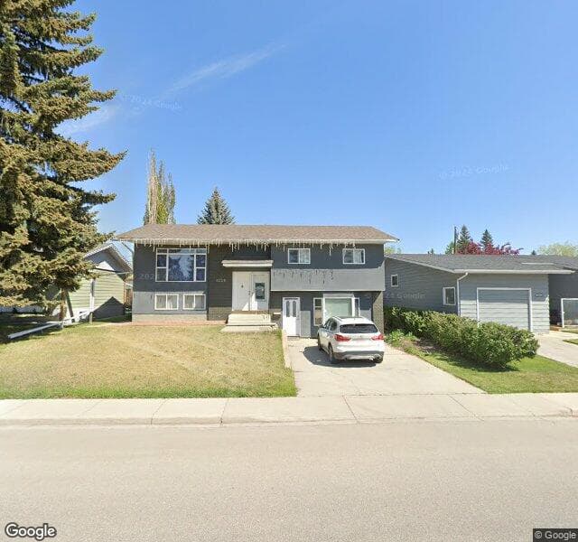 Street view of 1228 Lake Sylvan Drive SE, Calgary