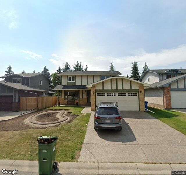 Street view of 103 Woodmont Crescent SW, Calgary