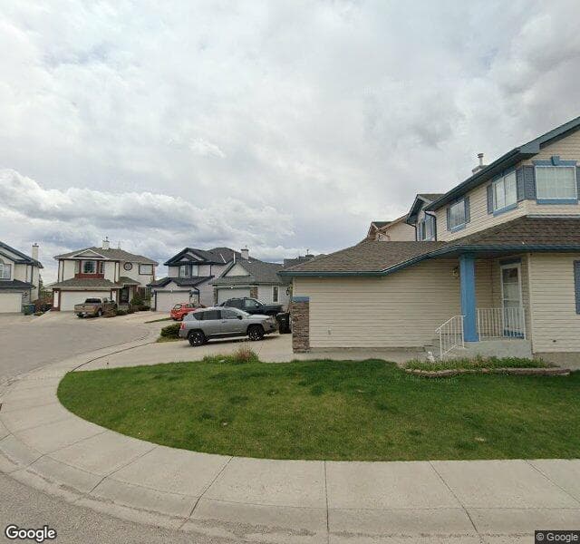 Street view of 134 Rocky Ridge Mews NW, Calgary