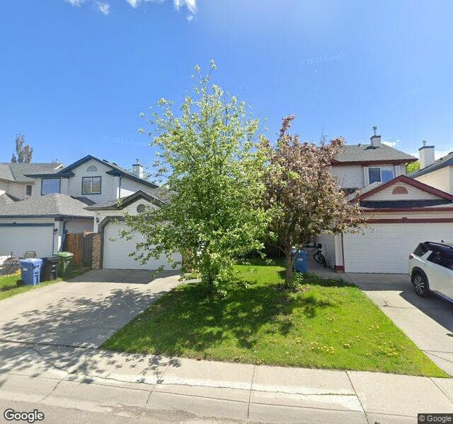 Street view of 111 Mount Apex Crescent SE, Calgary