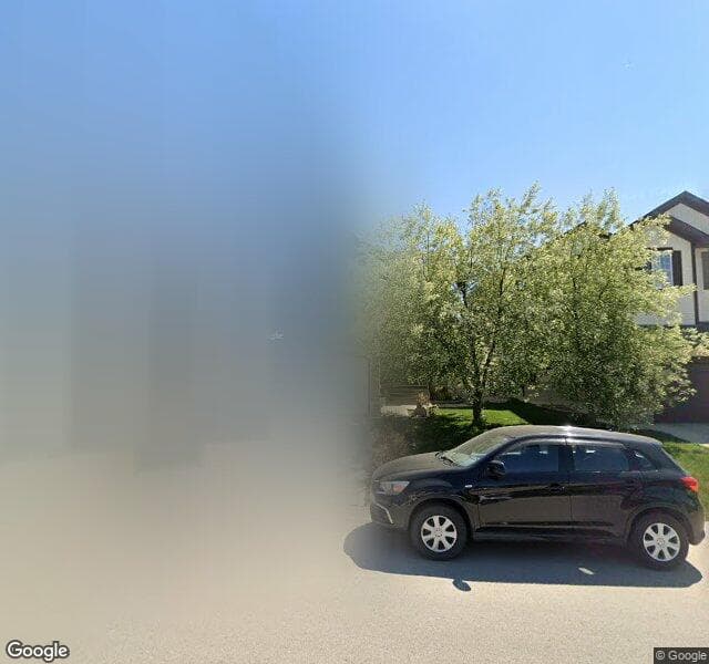 Street view of 113 Cougarstone Manor SW, Calgary