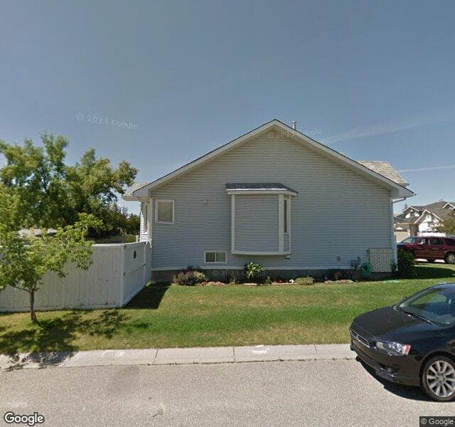 Street view of 131 Woodmark Crescent SW, Calgary