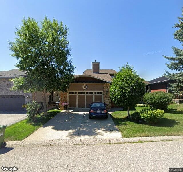 Street view of 124 Strathbury Circle SW, Calgary