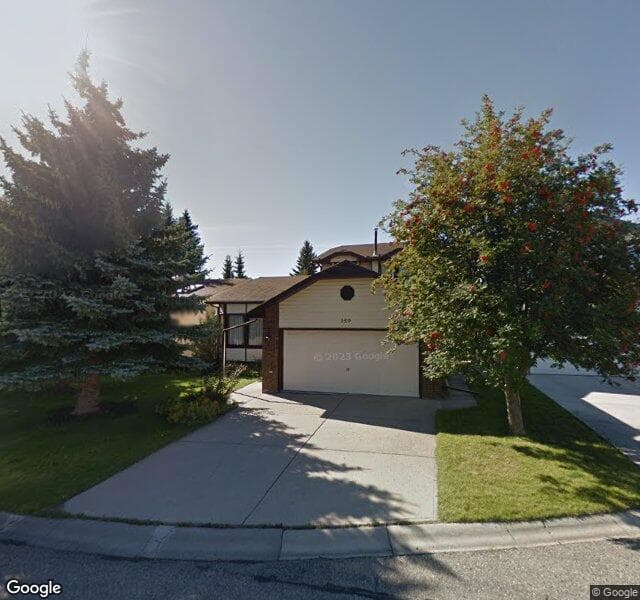 Street view of 159 Woodstock Place SW, Calgary
