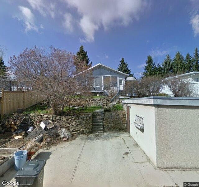 Street view of 1024 Huntercove Place NW, Calgary