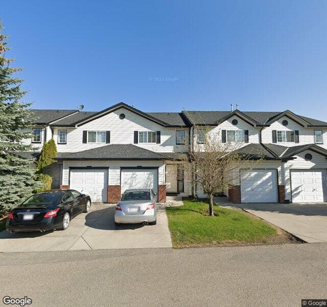 Street view of 324 Country Village Cape NE, Calgary