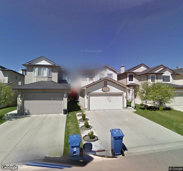 Street view of 1047 Bridlemeadows Manor SW, Calgary