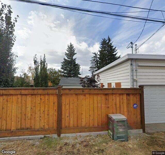 Street view of 2412 Langriville Drive SW, Calgary