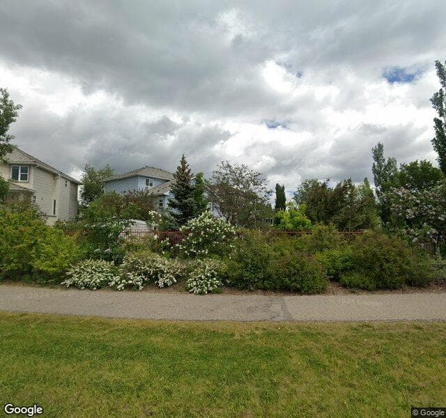 Street view of 153 Rocky Ridge Cove NW, Calgary