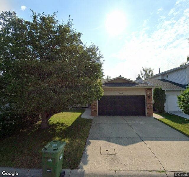 Street view of 208 Woodstock Place SW, Calgary